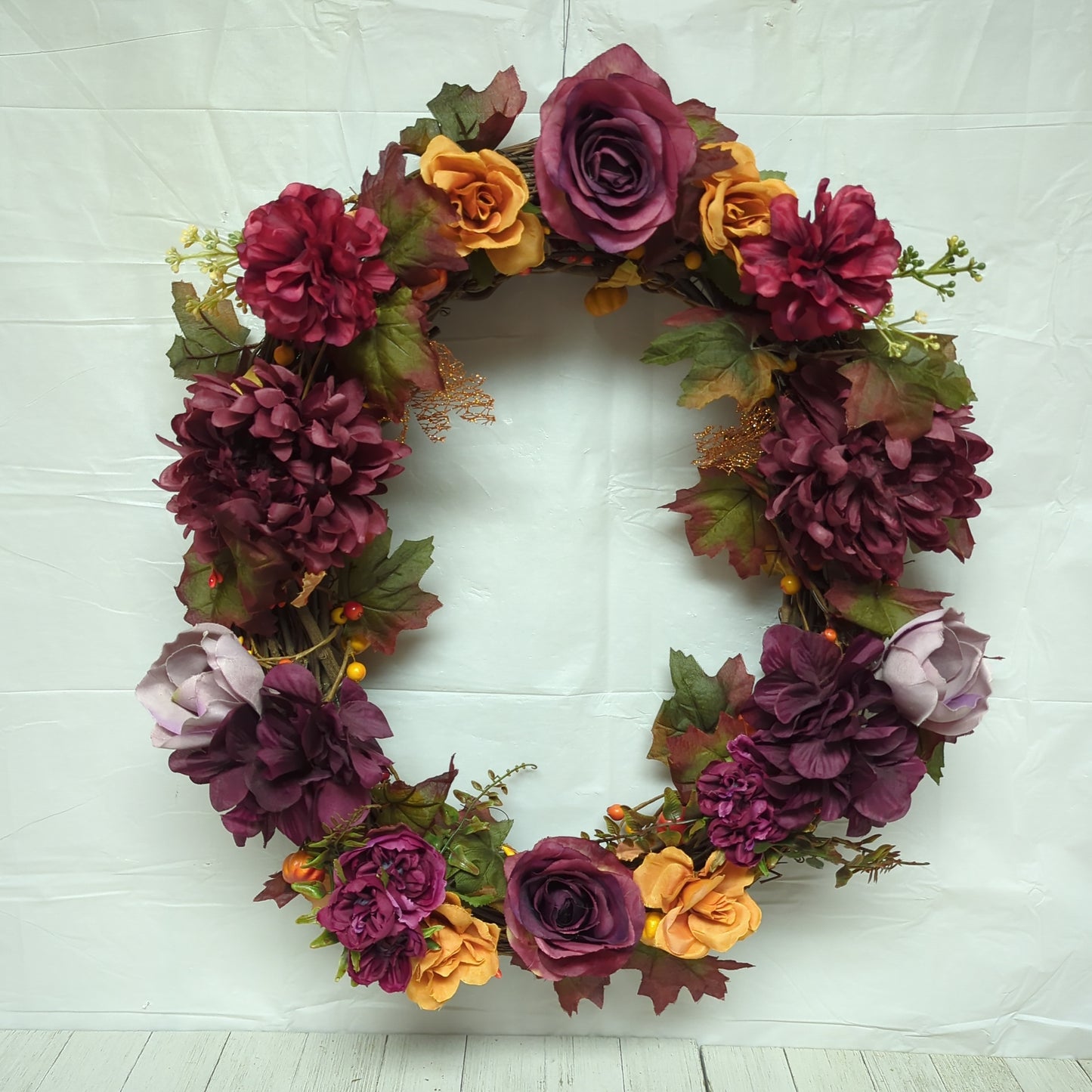 A wreath with dark purple flowers