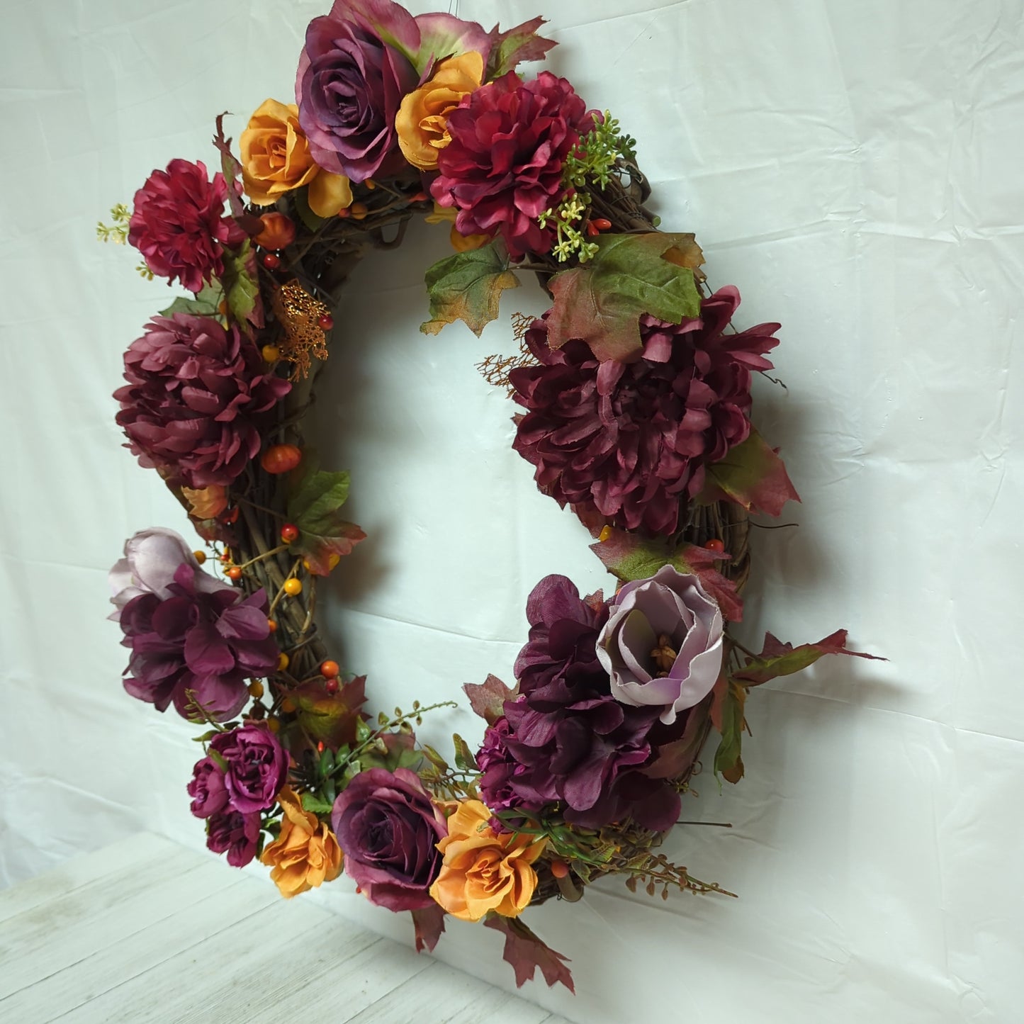 A wreath with dark purple flowers