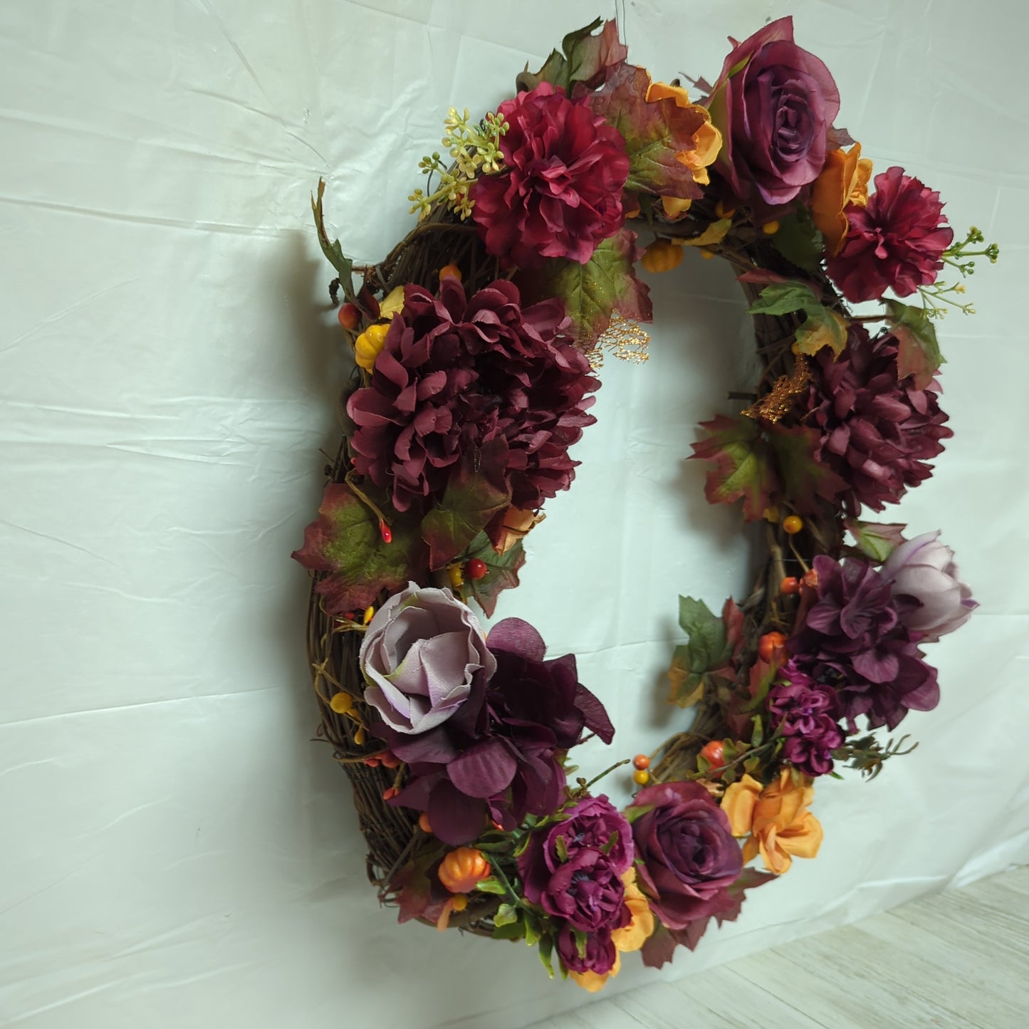 A wreath with dark purple flowers