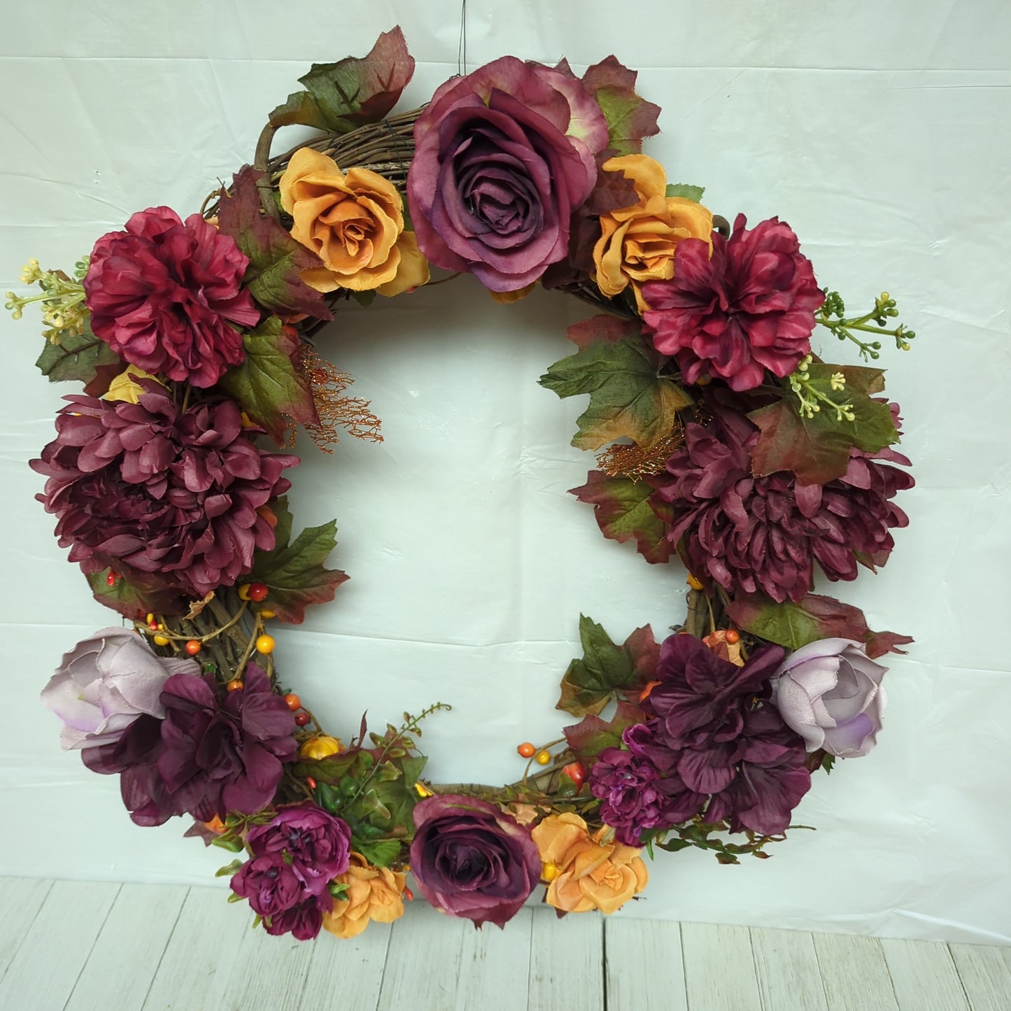 A wreath with dark purple flowers