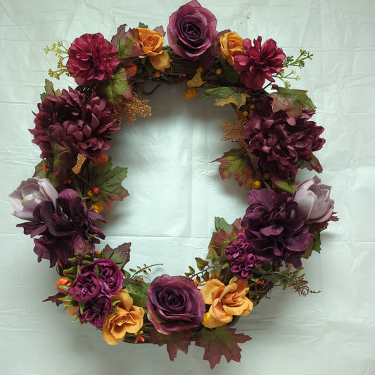 A wreath with dark purple flowers