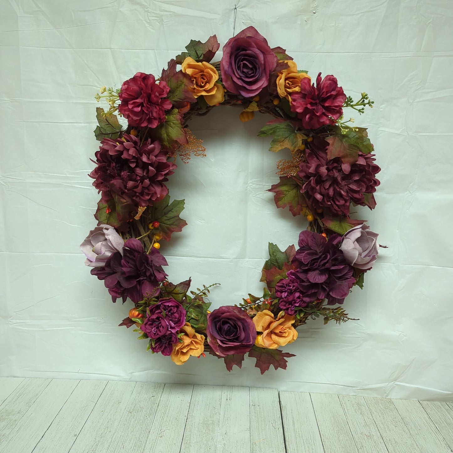 A wreath with dark purple flowers