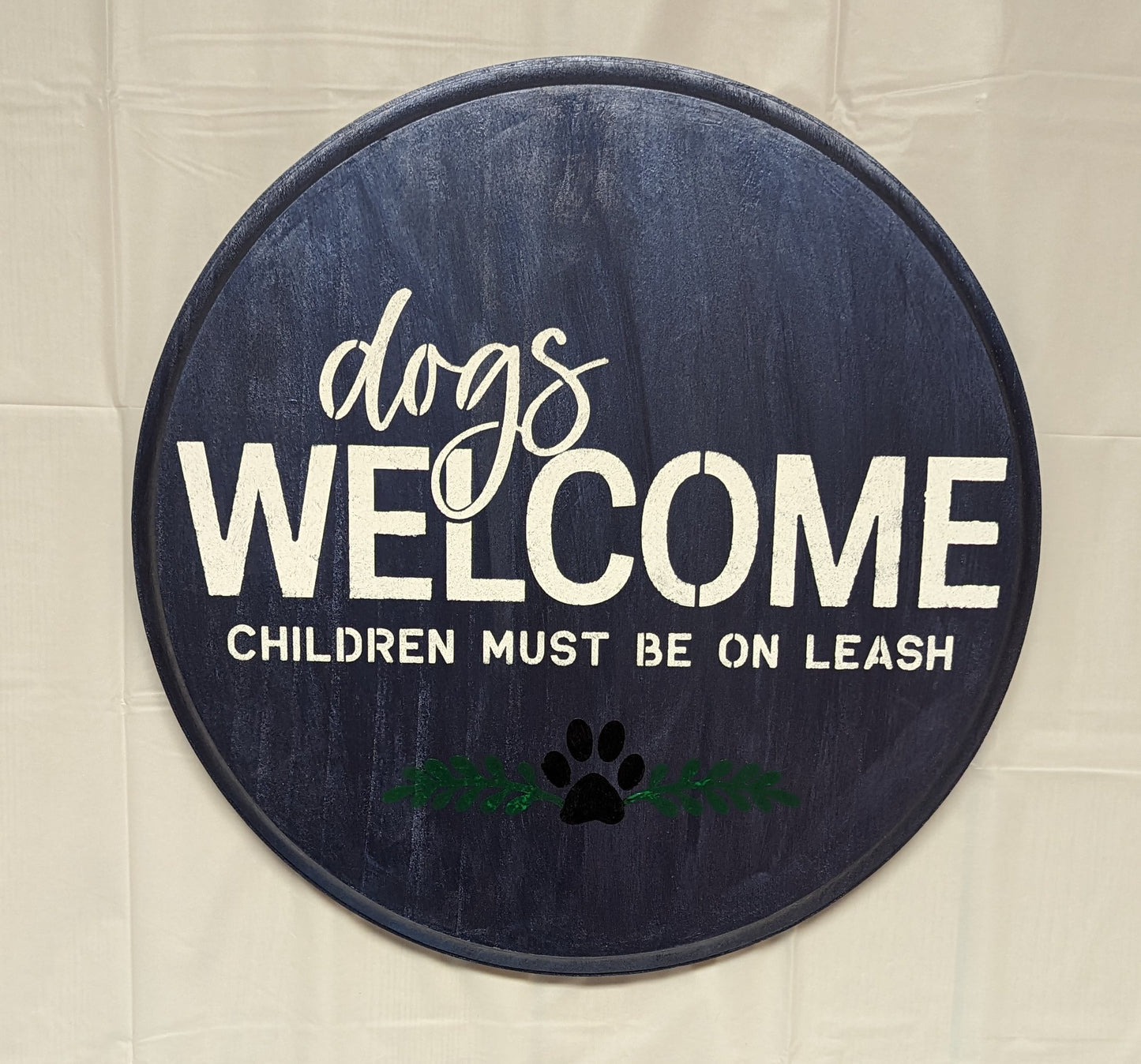 Dogs in Welcome wood sign