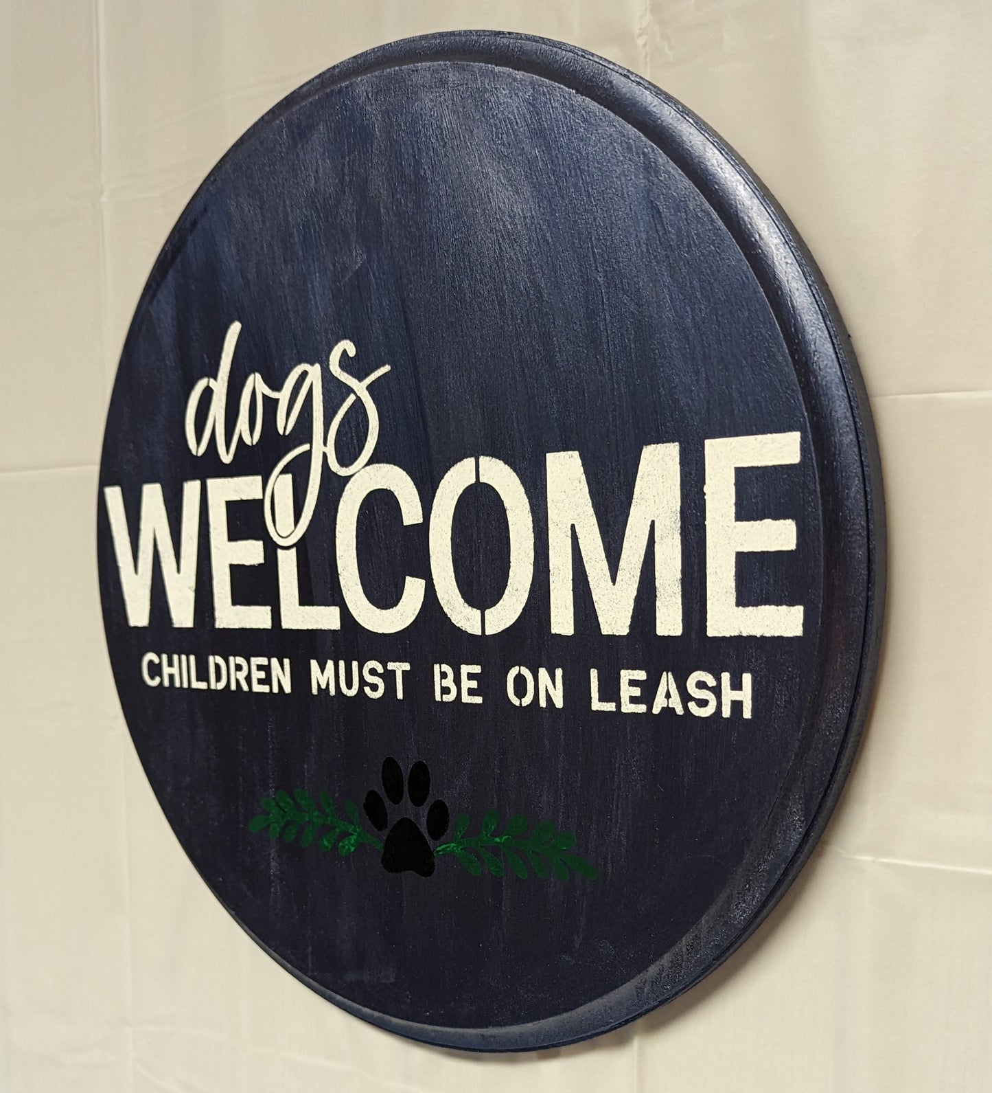 Dogs in Welcome wood sign