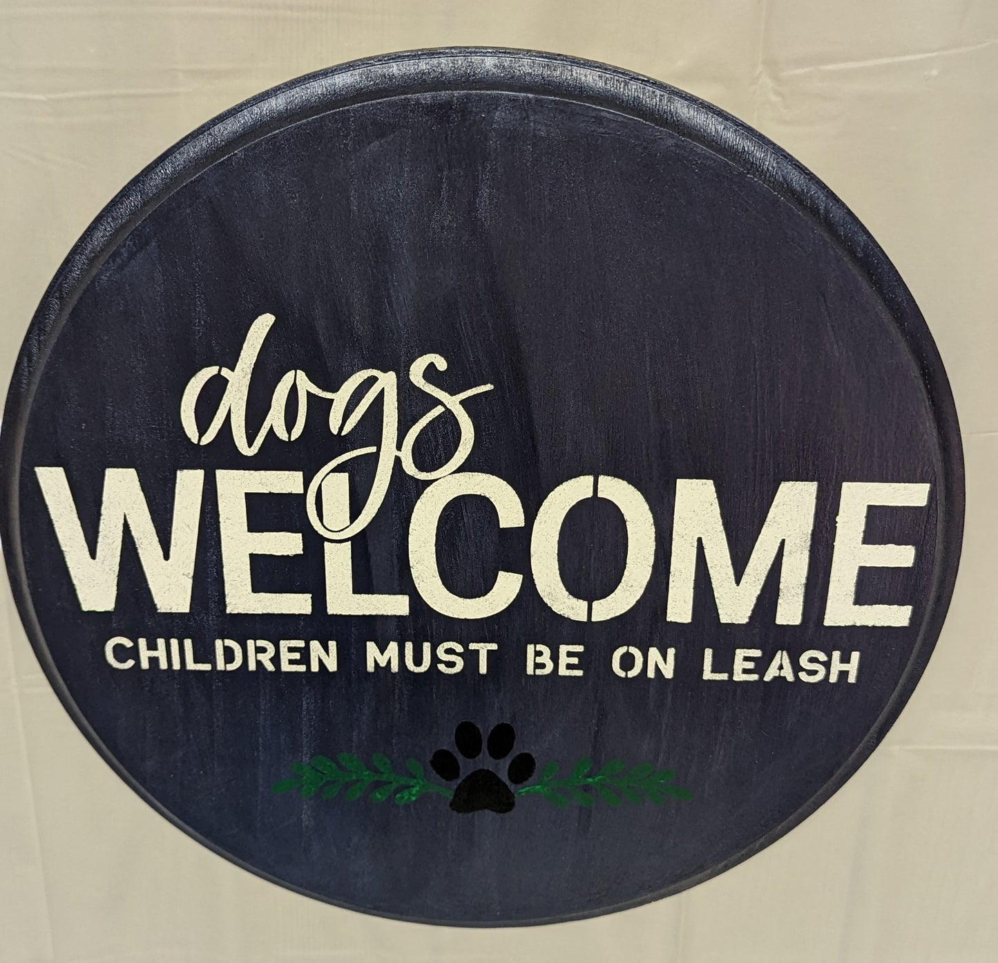 Dogs in Welcome wood sign