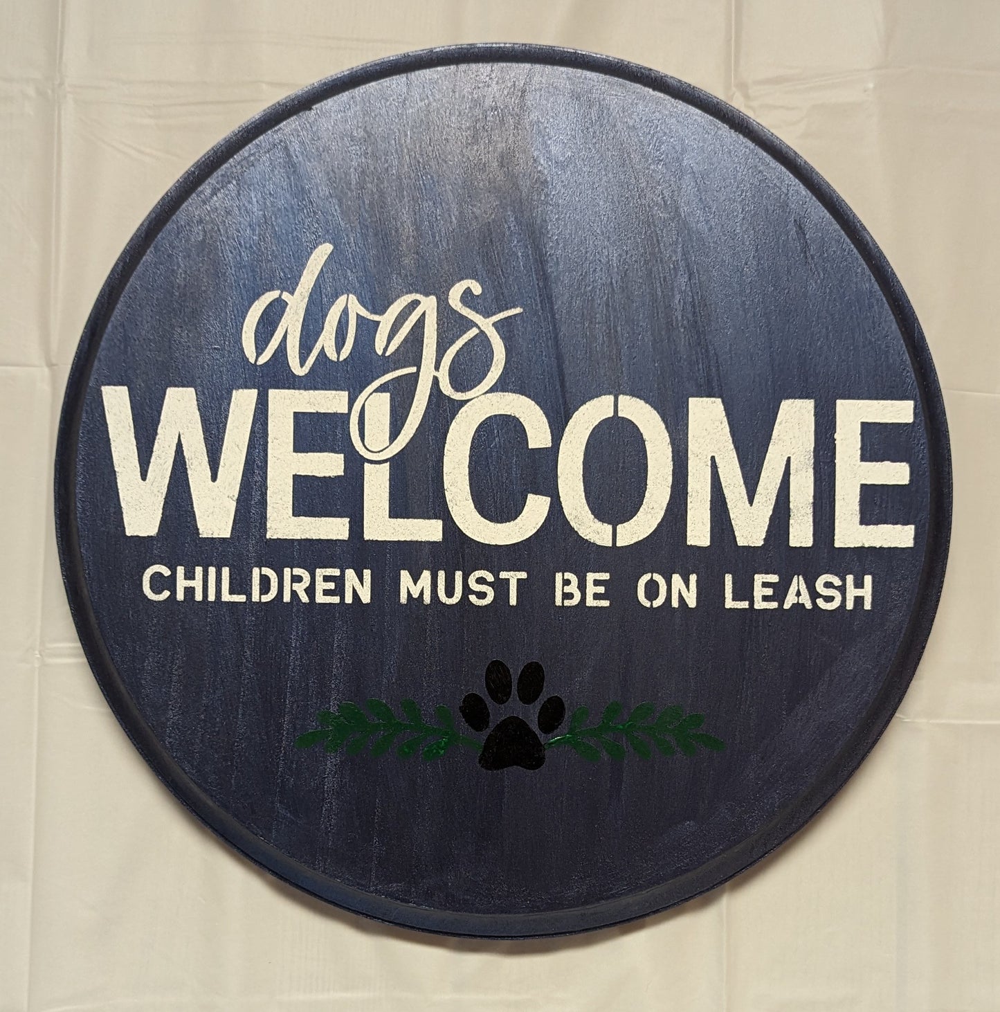 Dogs in Welcome wood sign