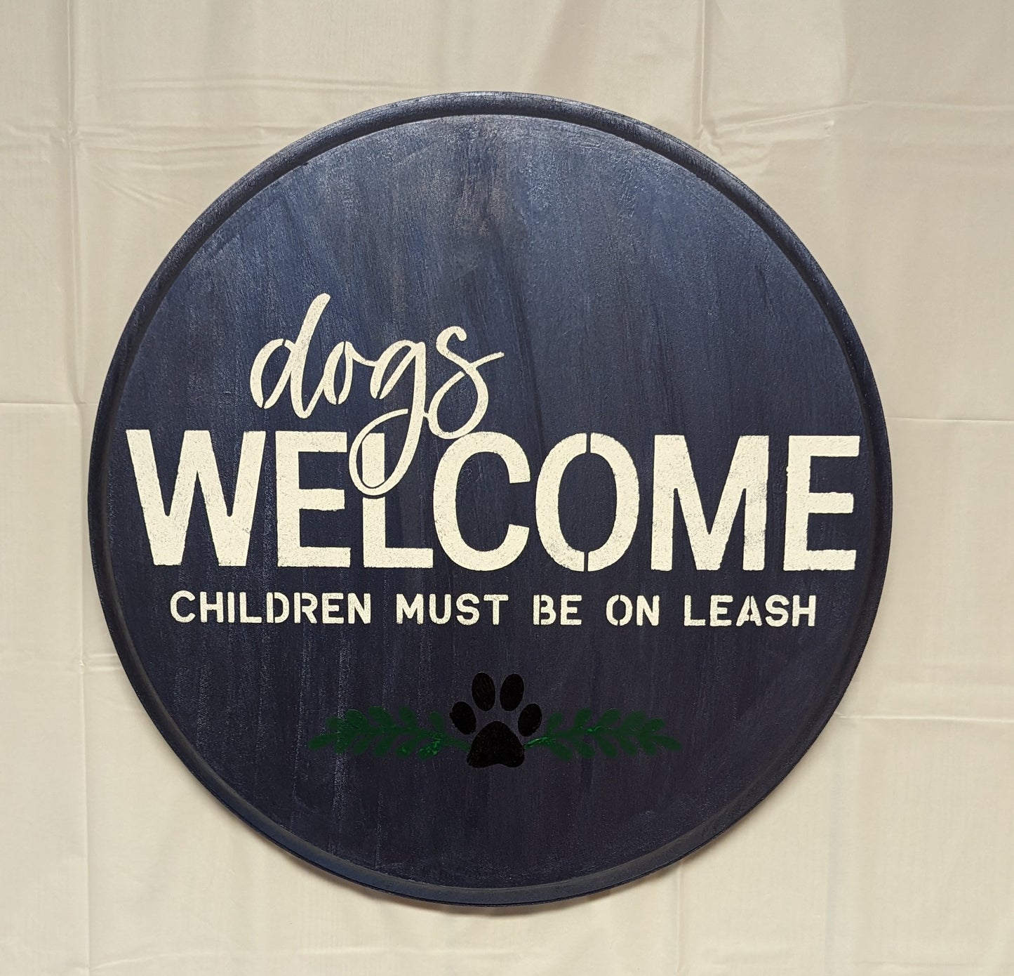 Dogs in Welcome wood sign